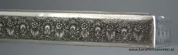 details of finely engraved decoration